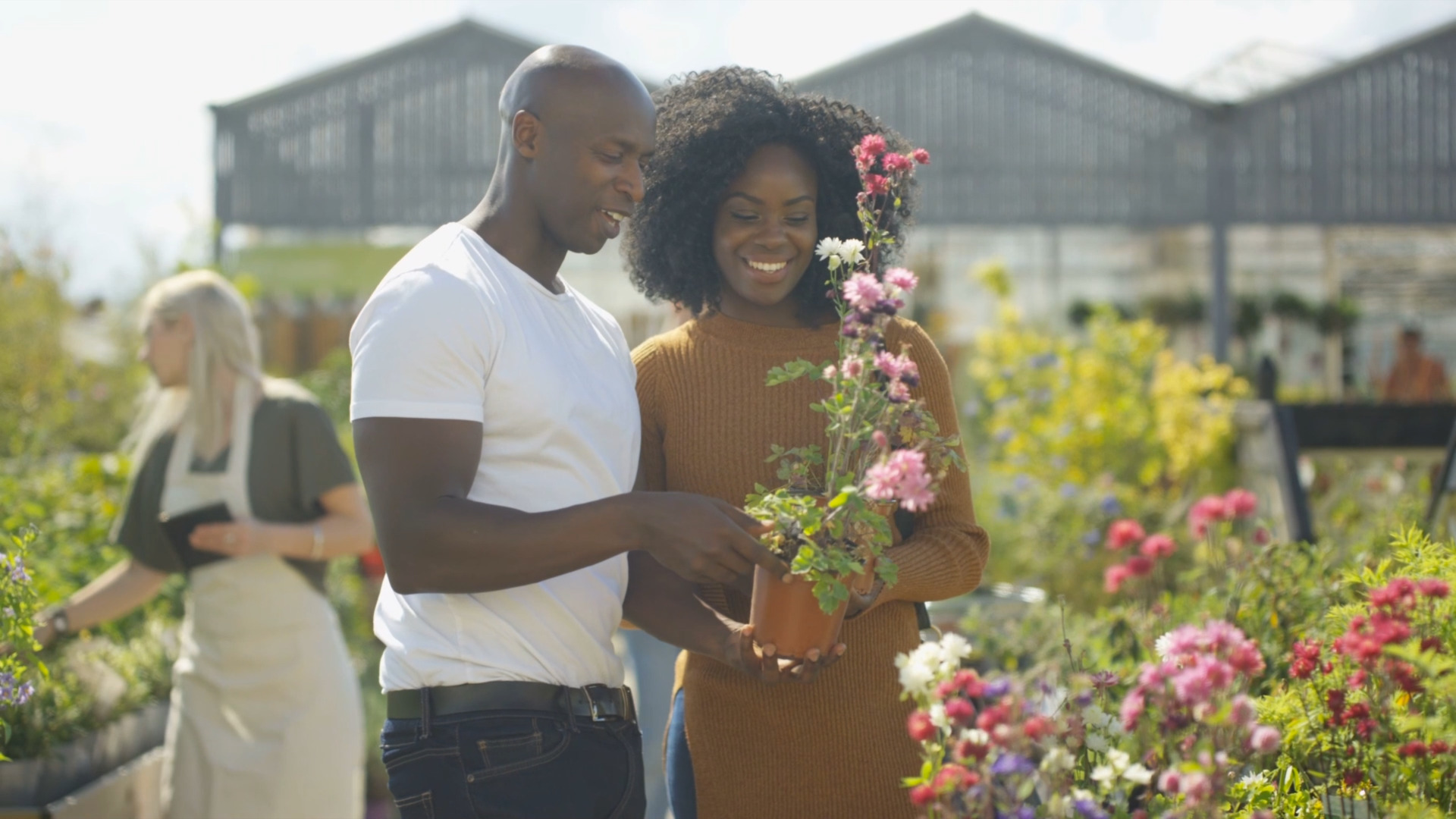 two people buying plants at a nursery and garden center